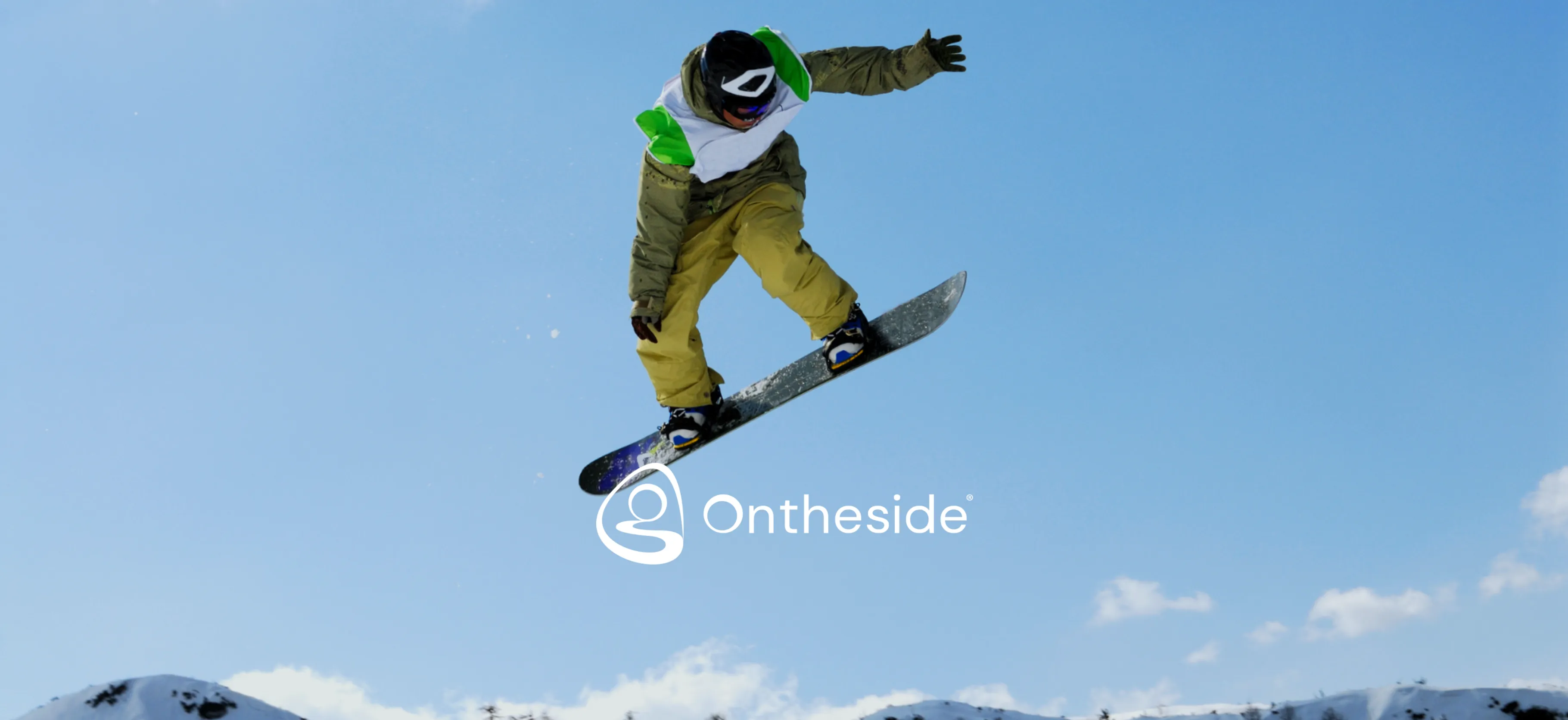 picture of ots logo and man on a snowboard